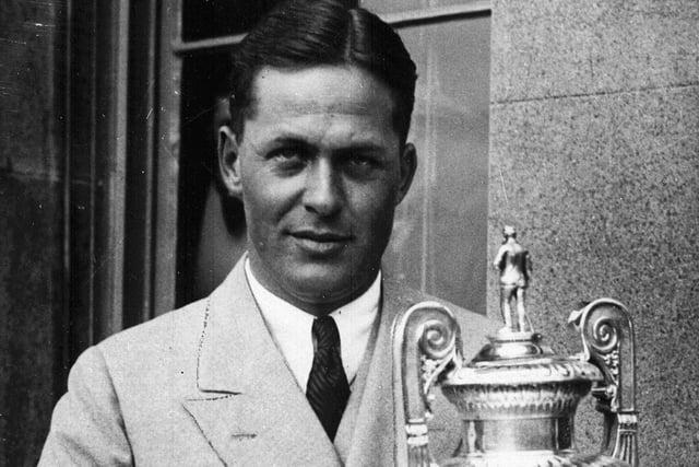 American golfing legend Bobby Jones with the British Amateur Championship golf trophy at St Andrews in 1930.