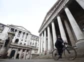 A woman cycling past the Bank of England and the Royal Exchange in the City of London. Picture: Kirsty O'Connor/PA Wire