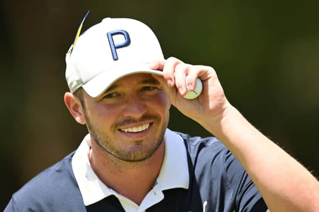 Ewen Ferguson acknowledges the crowd during the second round of the Magical Kenya Open at Muthaiga Golf Club in Nairobi. Picture: Stuart Franklin/Getty Images.