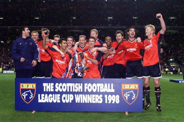 Giovanni van Bronckhorst (fifth from left) celebrates with his team-mates after winning his first trophy as a Rangers player with the League Cup Final triumph over St Johnstone at Celtic Park in November 1998. (Photo by SNS Group).