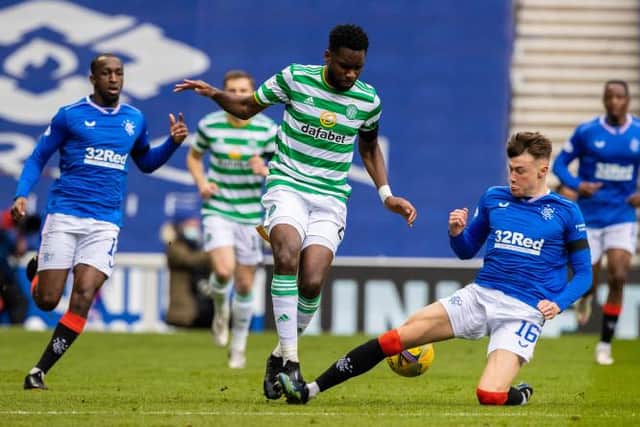 Celtic's Odsonne Edouard (left) is tackled by Rangers' Nathan Patterson during a Scottish Cup tie between Rangers and Celtic at Ibrox Stadium. (Photo by Craig Williamson / SNS Group)