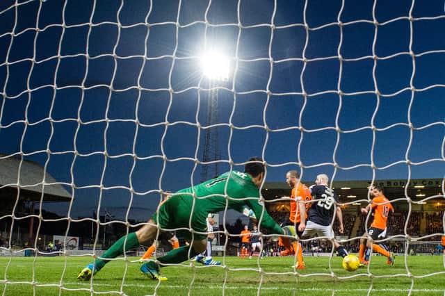 Craig Wighton's late winner makes it 2-1 to Dundee at Dens on the night Dundee United were relegated. Dundee have since won only 30 out of 100 home league games