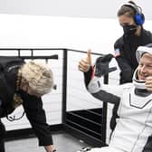 European Space Agency's astronaut Matthais Maurer gives a thumbs up after being helped out of the SpaceX Crew Dragon Endurance spacecraft onboard the SpaceX Shannon recovery ship after he and NASA astronauts Raja Chari, Kayla Barron, Tom Marshburn, landed in the Gulf of Mexico off the coast of Tampa, Florida, Friday, May 6, 2022. (Aubrey Gemignani/NASA via AP)