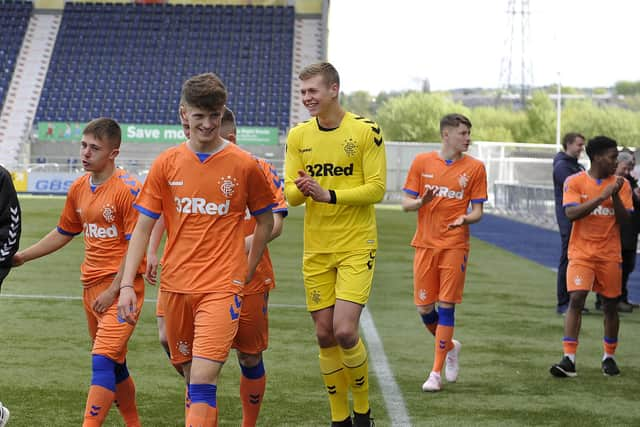 Hogarth alongside team-mates including Kai Kennedy and Nathan Patterson (Picture: Michael Gillen)