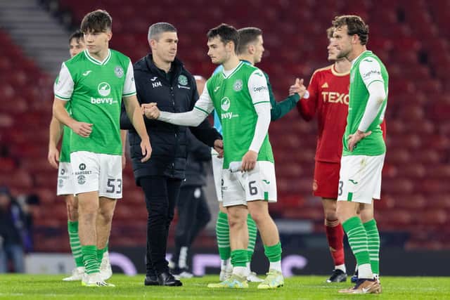 Hibs manager Nick Montgomery consoles his players after the 1-0 defeat by Aberdeen at Hampden.