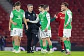 Hibs manager Nick Montgomery consoles his players after the 1-0 defeat by Aberdeen at Hampden.