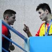 Sun Yang of China clashes with Duncan Scott during the medal ceremony for the men's 200m freestyle final at the 2019 FINA World Championships in South Korea. Picture: Quinn Rooney/Getty Images