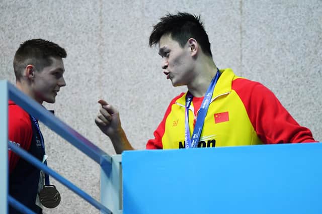 Sun Yang of China clashes with Duncan Scott during the medal ceremony for the men's 200m freestyle final at the 2019 FINA World Championships in South Korea. Picture: Quinn Rooney/Getty Images