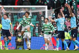 Dundee claim for a penalty after the ball hits Celtic's Jota (centre) on the arm during a Cinch Premiership match between Celtic and Dundee at Celtic Park, on February 20, 2022, in Glasgow, Scotland. (Photo by Craig Williamson / SNS Group)