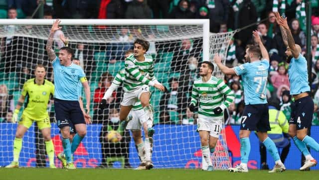 Dundee claim for a penalty after the ball hits Celtic's Jota (centre) on the arm during a Cinch Premiership match between Celtic and Dundee at Celtic Park, on February 20, 2022, in Glasgow, Scotland. (Photo by Craig Williamson / SNS Group)