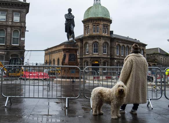 The newly restored Burns statue reinstated in Leith. Picture: Lisa Ferguson
Newly restored Burns statue reinstated in Leith as nation celebrates Scotland’s bard
An event will be held to mark the reinstatement of the 124-year old bronze statue, which was removed in 2019 to allow for Trams to Newhaven works. Elected members, conservationists and project team directors will hear a reading by former Edinburgh Makar Alan Spence of poems specially written for a time capsule placed under the statue,. This includes his own poem, Interesting Times.
ouncil Leader, Adam McVey; Depute Leader, Cammy Day; Transport and Environment Convener, Councillor Lesley Macinnes; Transport and Environment Vice Convener, Councillor Karen Doran; City of Edinburgh Archaeologist, John Lawson; Conservationist Nic Boyes; former Edinburgh Makar Alan Spence.
LATEST NEWS: Newly restored Burns statue unveiled in Leith
Leith’s iconic Burns statue has been returned to its home on Bernard Street, as Scotland prepares to celebrate the national bard.
The 19th century bronze sculpture was put into storage in December 2019 to make way for Trams to Newhaven construction. It has since undergone specialist conservation work before its reinstatement at Bernard Street’s junction with Constitution Street.
On the morning of Burns Night (Tuesday, 25 January), Council leaders, tram project officers and contractors were joined by conservationists and former Edinburgh Makar Alan Spence to officially unveil the monument. They also marked the placement of a new time capsule underneath the statue, alongside an original capsule discovered in 2019, which contained relics from both the late 19th century and the 1960s.