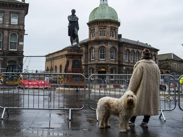The newly restored Burns statue reinstated in Leith. Picture: Lisa Ferguson





Newly restored Burns statue reinstated in Leith as nation celebrates Scotlandâ€™s bard



An event will be held to mark the reinstatement of the 124-year old bronze statue, which was removed in 2019 to allow for Trams to Newhaven works. Elected members, conservationists and project team directors will hear a reading by former Edinburgh Makar Alan Spence of poems specially written for a time capsule placed under the statue,. This includes his own poem, Interesting Times.

ouncil Leader, Adam McVey; Depute Leader, Cammy Day; Transport and Environment Convener, Councillor Lesley Macinnes; Transport and Environment Vice Convener, Councillor Karen Doran; City of Edinburgh Archaeologist, John Lawson; Conservationist Nic Boyes; former Edinburgh Makar Alan Spence.



LATEST NEWS: Newly restored Burns statue unveiled in Leith



Leithâ€™s iconic Burns statue has been returned to its home on Bernard Street, as Scotland prepares to celebrate the national bard.



The 19th century bronze sculpture was put into storage in December 2019 to make way for Trams to Newhaven construction. It has since undergone specialist conservation work before its reinstatement at Bernard Streetâ€™s junction with Constitution Street.



On the morning of Burns Night (Tuesday, 25 January), Council leaders, tram project officers and contractors were joined by conservationists and former Edinburgh Makar Alan Spence to officially unveil the monument. They also marked the placement of a new time capsule underneath the statue, alongside an original capsule discovered in 2019, which contained relics from both the late 19th century and the 1960s.