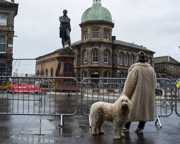 The newly restored Burns statue reinstated in Leith. Picture: Lisa Ferguson





Newly restored Burns statue reinstated in Leith as nation celebrates Scotlandâ€™s bard



An event will be held to mark the reinstatement of the 124-year old bronze statue, which was removed in 2019 to allow for Trams to Newhaven works. Elected members, conservationists and project team directors will hear a reading by former Edinburgh Makar Alan Spence of poems specially written for a time capsule placed under the statue,. This includes his own poem, Interesting Times.

ouncil Leader, Adam McVey; Depute Leader, Cammy Day; Transport and Environment Convener, Councillor Lesley Macinnes; Transport and Environment Vice Convener, Councillor Karen Doran; City of Edinburgh Archaeologist, John Lawson; Conservationist Nic Boyes; former Edinburgh Makar Alan Spence.



LATEST NEWS: Newly restored Burns statue unveiled in Leith



Leithâ€™s iconic Burns statue has been returned to its home on Bernard Street, as Scotland prepares to celebrate the national bard.



The 19th century bronze sculpture was put into storage in December 2019 to make way for Trams to Newhaven construction. It has since undergone specialist conservation work before its reinstatement at Bernard Streetâ€™s junction with Constitution Street.



On the morning of Burns Night (Tuesday, 25 January), Council leaders, tram project officers and contractors were joined by conservationists and former Edinburgh Makar Alan Spence to officially unveil the monument. They also marked the placement of a new time capsule underneath the statue, alongside an original capsule discovered in 2019, which contained relics from both the late 19th century and the 1960s.