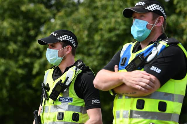 Police Scotland officers wearing PPE. Picture: John Devlin