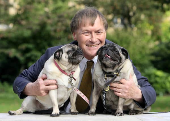 David Amess with his dogs Lilly and Bo. Tributes have been paid from across the political spectrum