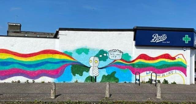 The colourful mural in Cardonald replaced racist graffiti with a more hopeful, positive message: 'Racism's kind of *****, isn't it?' on Saturday evening.