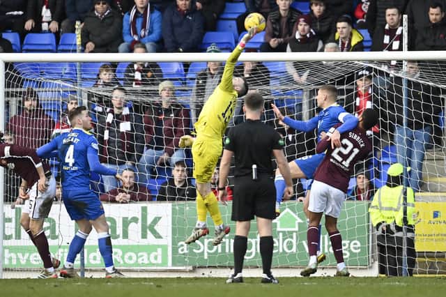 Stand-in goalkeeper Ross Stewart punches clear during a cinch Premiership match between St Johnstone and Hearts.
