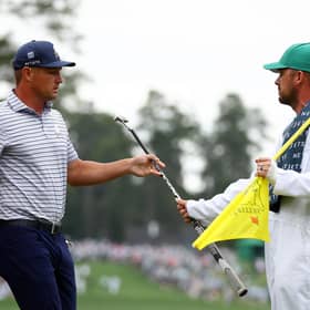 Bryson DeChambeau hands his club to his caddie on the first green during the first round of the 2024 Masters Tournament at Augusta National Golf Club. Picture: Maddie Meyer/Getty Images.