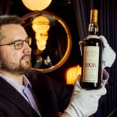 Whisky auctioneer founder Iain Mcclune with the 'Holy Grail' Macallan