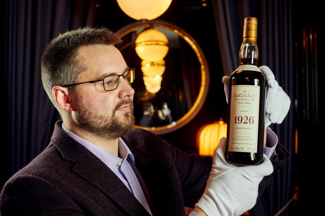 Whisky auctioneer founder Iain Mcclune with the 'Holy Grail' Macallan