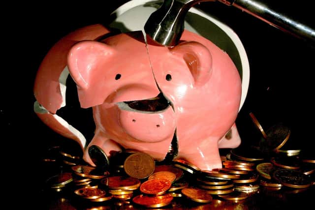 Cost-of-living pressures have forced many people to raid their piggy banks.