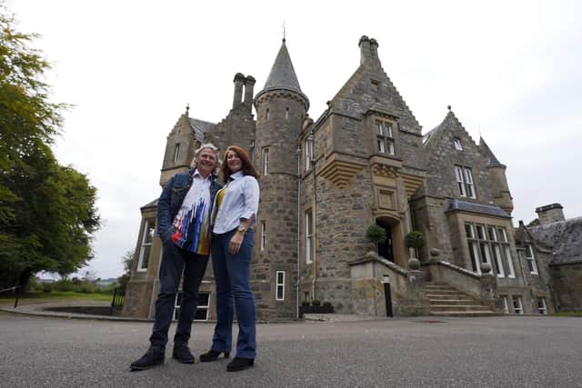 Homeowners John and Tanya outside The Mansion Apartment on the Beauly Firth. (Credit: Rory Dunning)