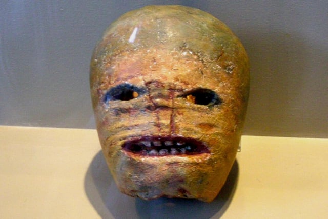 This is a carved turnip on display at the Museum of Country Life in Ireland, it is a historical example of how locals would carve turnips to resemble scary faces during Halloween.