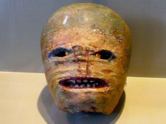 This is a carved turnip on display at the Museum of Country Life in Ireland, it is a historical example of how locals would carve turnips to resemble scary faces during Halloween.