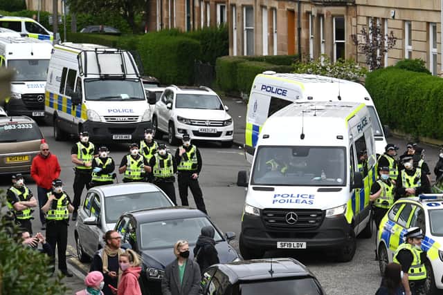 Police Scotland has bowed to mounting public pressure this afternoon, ordering the release of two men detained by immigration agents in Glasgow after a standoff with protesters.