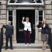 First Minister Nicola Sturgeon (centre) welcoming Scottish Green co-leaders Patrick Harvie and Lorna Slater at Bute House, Charlotte Square, Edinburgh