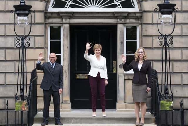 First Minister Nicola Sturgeon (centre) welcoming Scottish Green co-leaders Patrick Harvie and Lorna Slater at Bute House, Charlotte Square, Edinburgh