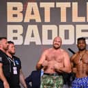 Tyson Fury and Francis Ngannou react in the face off during a press conference ahead of the boxing match at Boulevard Hall in Riyadh, Saudi Arabia. (Photo by Justin Setterfield/Getty Images)