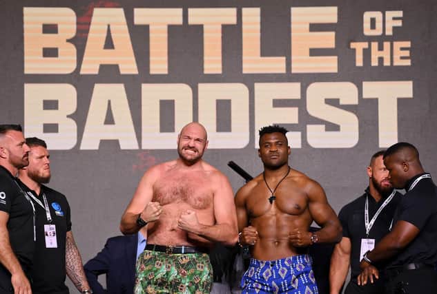 Tyson Fury and Francis Ngannou react in the face off during a press conference ahead of the boxing match at Boulevard Hall in Riyadh, Saudi Arabia. (Photo by Justin Setterfield/Getty Images)