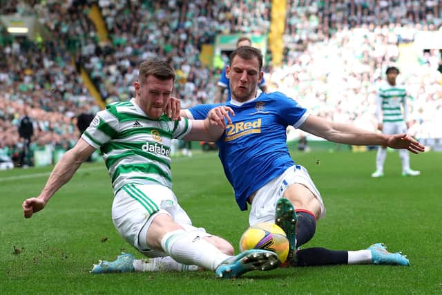 GLASGOW, SCOTLAND - MAY 01: Anthony Ralston of Celtic is challenged by Borna Barisic of Rangers during the Cinch Scottish Premiership match between Celtic  and Rangers at Celtic Park on May 01, 2022 in Glasgow, Scotland. (Photo by Ian MacNicol/Getty Images)