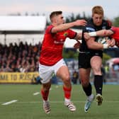 Glasgow's Kyle Steyn is thwarted in his attempts to reach the Munster line.  (Photo by Ross MacDonald / SNS Group)