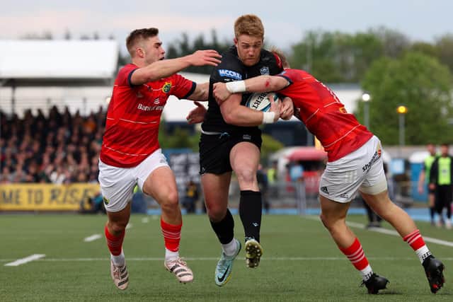 Glasgow's Kyle Steyn is thwarted in his attempts to reach the Munster line. (Photo by Ross MacDonald / SNS Group)