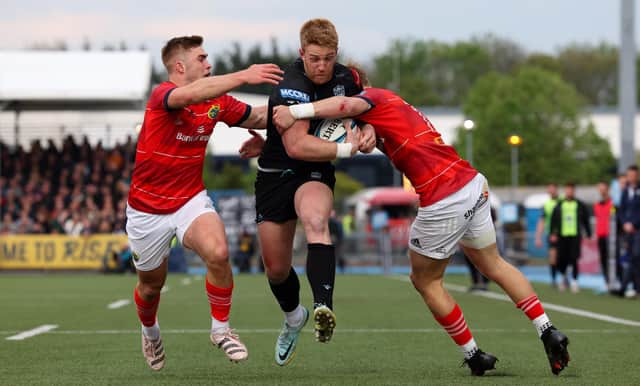Glasgow's Kyle Steyn is thwarted in his attempts to reach the Munster line. (Photo by Ross MacDonald / SNS Group)