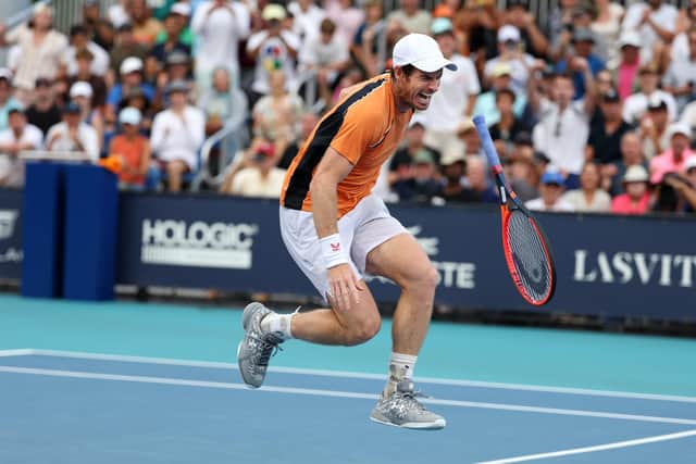 Andy Murray of Great Britain screams in pain after hurting his left ankle during his match against Tomas Machac.