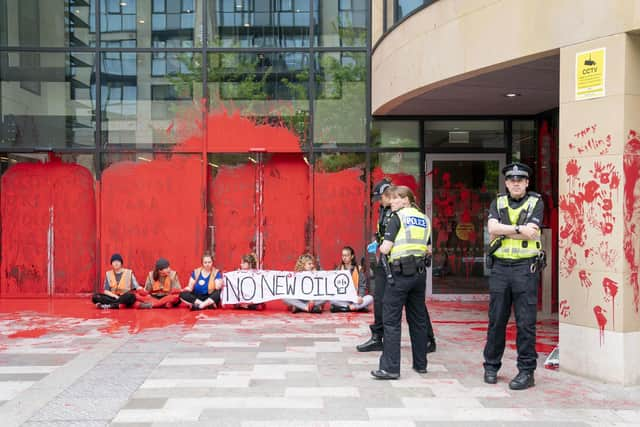 Campaigners demonstrating at Queen Elizabeth House in Edinburgh. JANE BARLOW/PA