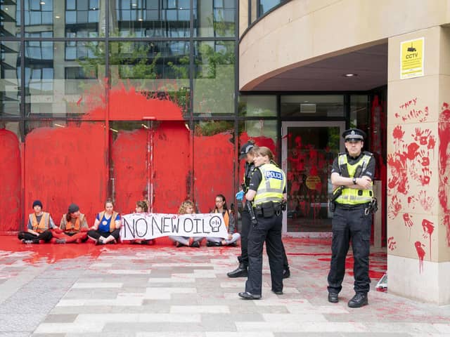 Campaigners demonstrating at Queen Elizabeth House in Edinburgh. JANE BARLOW/PA