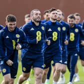 John McGinn leads the squad in warming up during a Scotland training session at Lesser Hampden on Tuesday.  (Photo by Craig Foy / SNS Group)