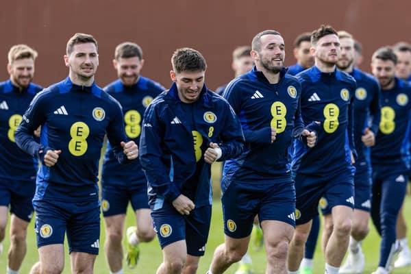 John McGinn leads the squad in warming up during a Scotland training session at Lesser Hampden on Tuesday.  (Photo by Craig Foy / SNS Group)
