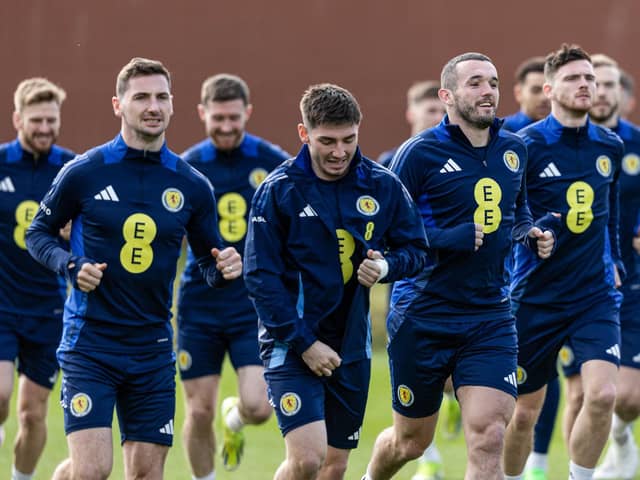John McGinn leads the squad in warming up during a Scotland training session at Lesser Hampden on Tuesday.  (Photo by Craig Foy / SNS Group)