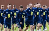 John McGinn leads the squad in warming up during a Scotland training session at Lesser Hampden on Tuesday.  (Photo by Craig Foy / SNS Group)