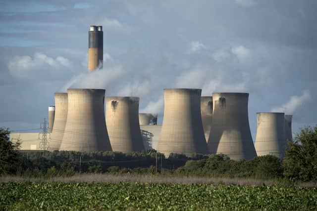 A view of the cooling towers of the Drax coal-fired power station near Selby, northern England on September 25, 2015. Energy company Drax has abandoned a 1 billion GBP installation of carbon capture technology to cut emissions, citing  the UK government's reduction of subsidies for renewable energy. AFP PHOTO / OLI SCARFF        (Photo credit should read OLI SCARFF,OLI SCARFF/AFP via Getty Images)