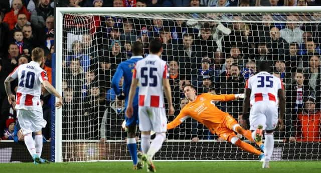 GLASGOW, SCOTLAND - MARCH 10: Rangers' goalkeeper Allan McGregor saves a penalty Red Star's Aleksandar Katai during a UEFA Europa League match between Rangers and Red Star Belgrade at Ibrox Stadium, on March 10, 2022, in Glasgow, Scotland. (Photo by Alan Harvey / SNS Group)