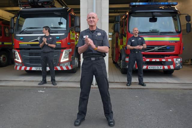 Community spirit: firefighters in Falkirk clap for NHS workers, carers and other essential workers (Picture: Michael Gillen)