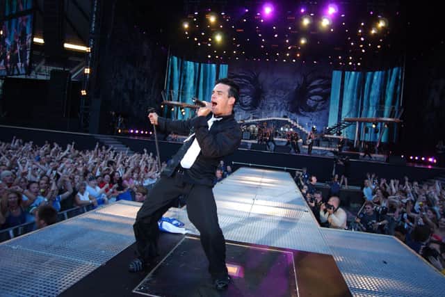 Robbie Williams belts it out at Edinburgh's Murrayfield Stadium back in his sex-god days (Picture: Tony Marsh)