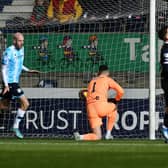 Zak Rudden opens the scoring for Dundee from the penalty spot. Picture: Michael Gillen