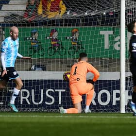 Zak Rudden opens the scoring for Dundee from the penalty spot. Picture: Michael Gillen